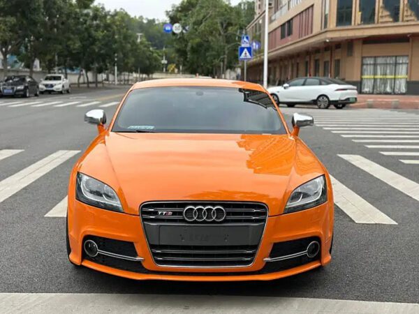 The used coupe car Audi TTS with orange color